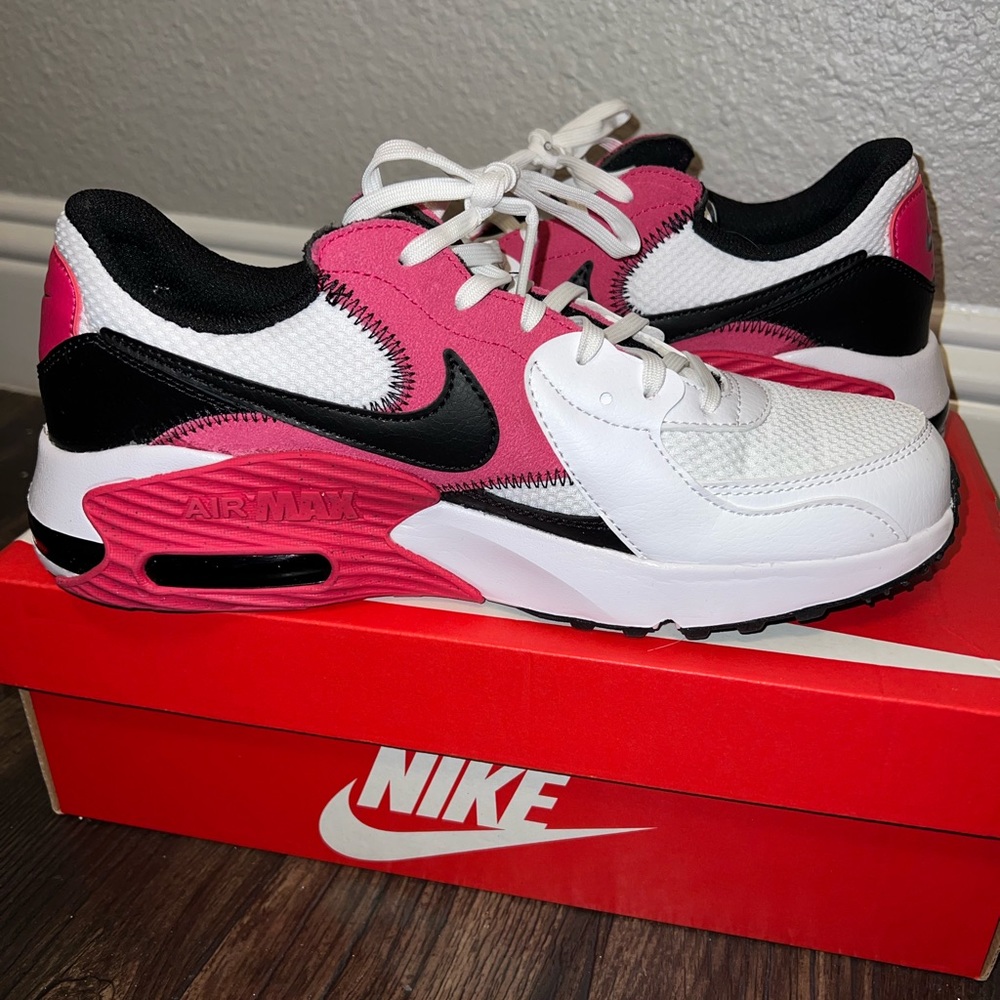 Pink and white Nike air max shoes